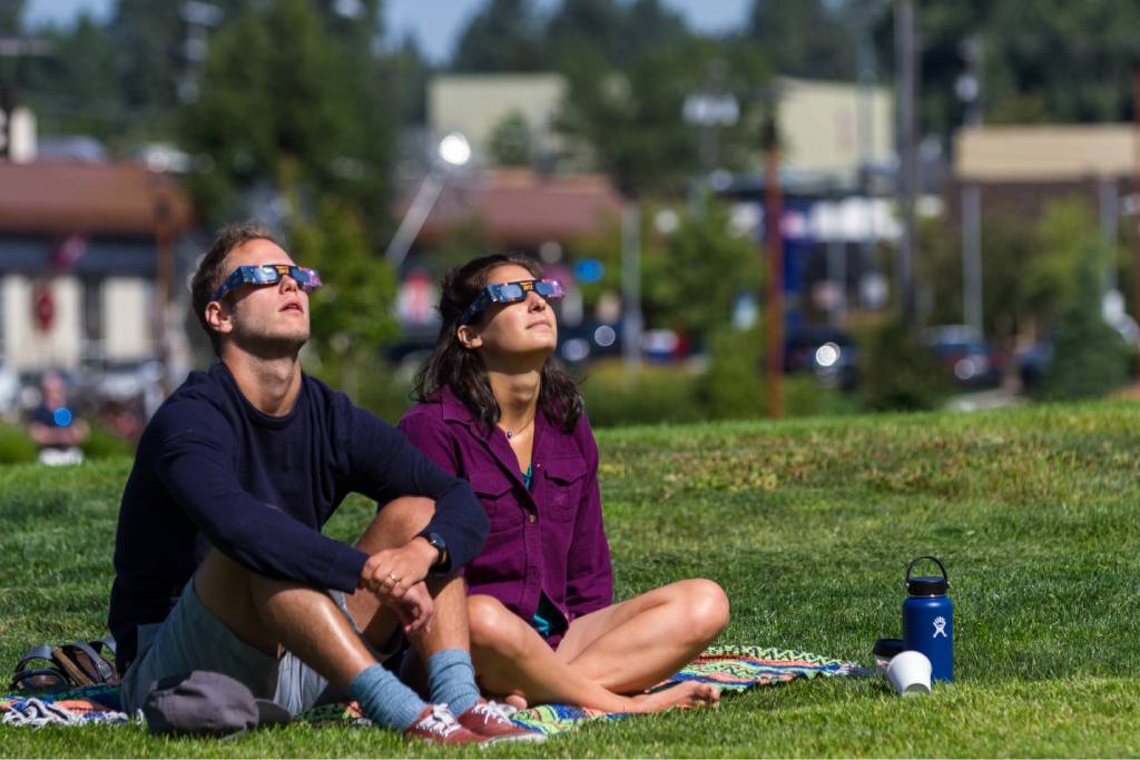 A couple watching the solar eclipse New Hampshire.